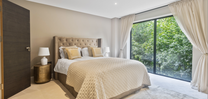 Bedroom offers ceiling to floor windows